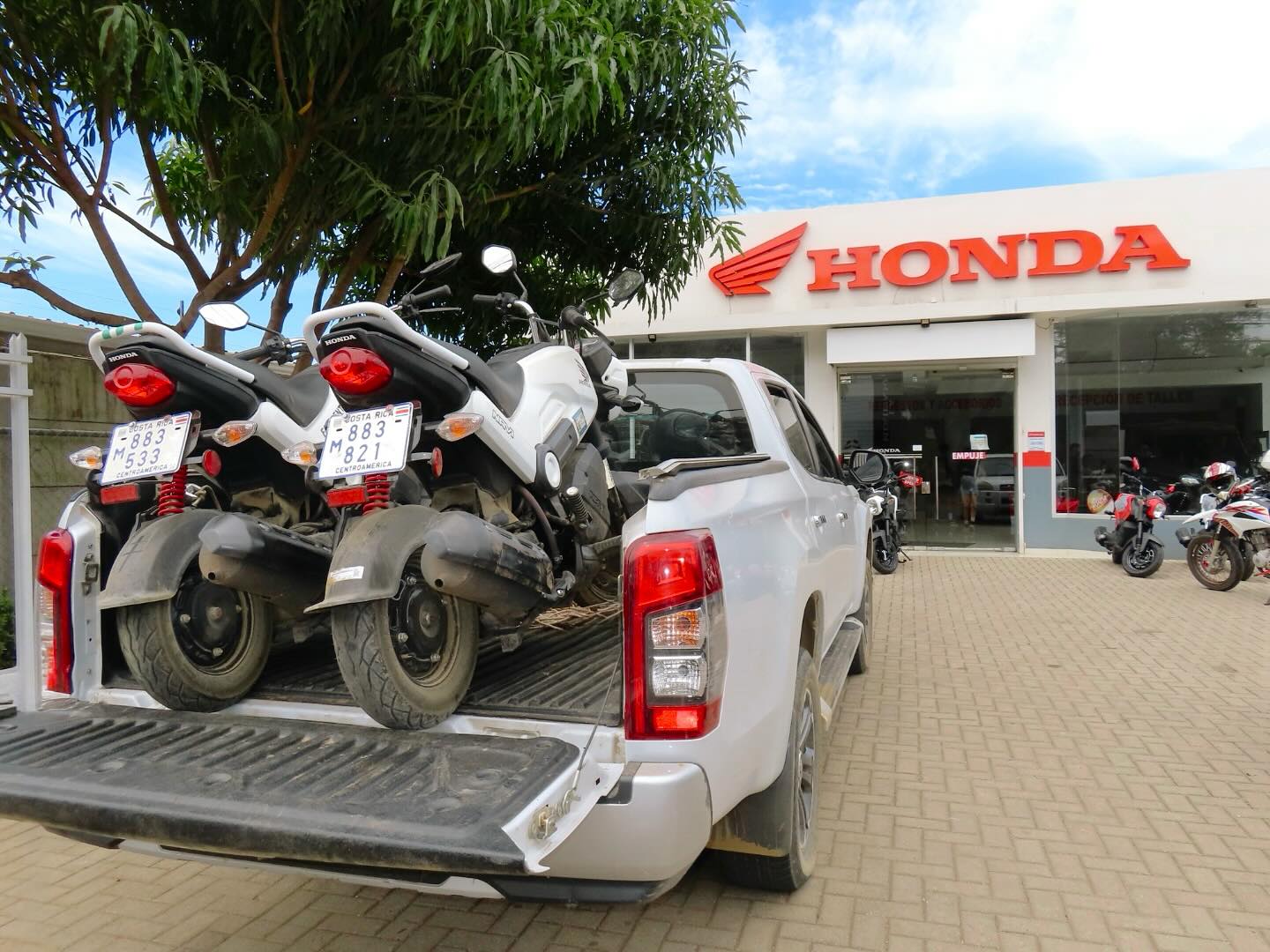 Honda Navi scooters on beach sand